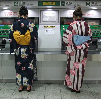 In the summer, young Tokyoites can often be seen wearing Yukata (informal Kimono), like these women buying tickets in Shinjuku Station